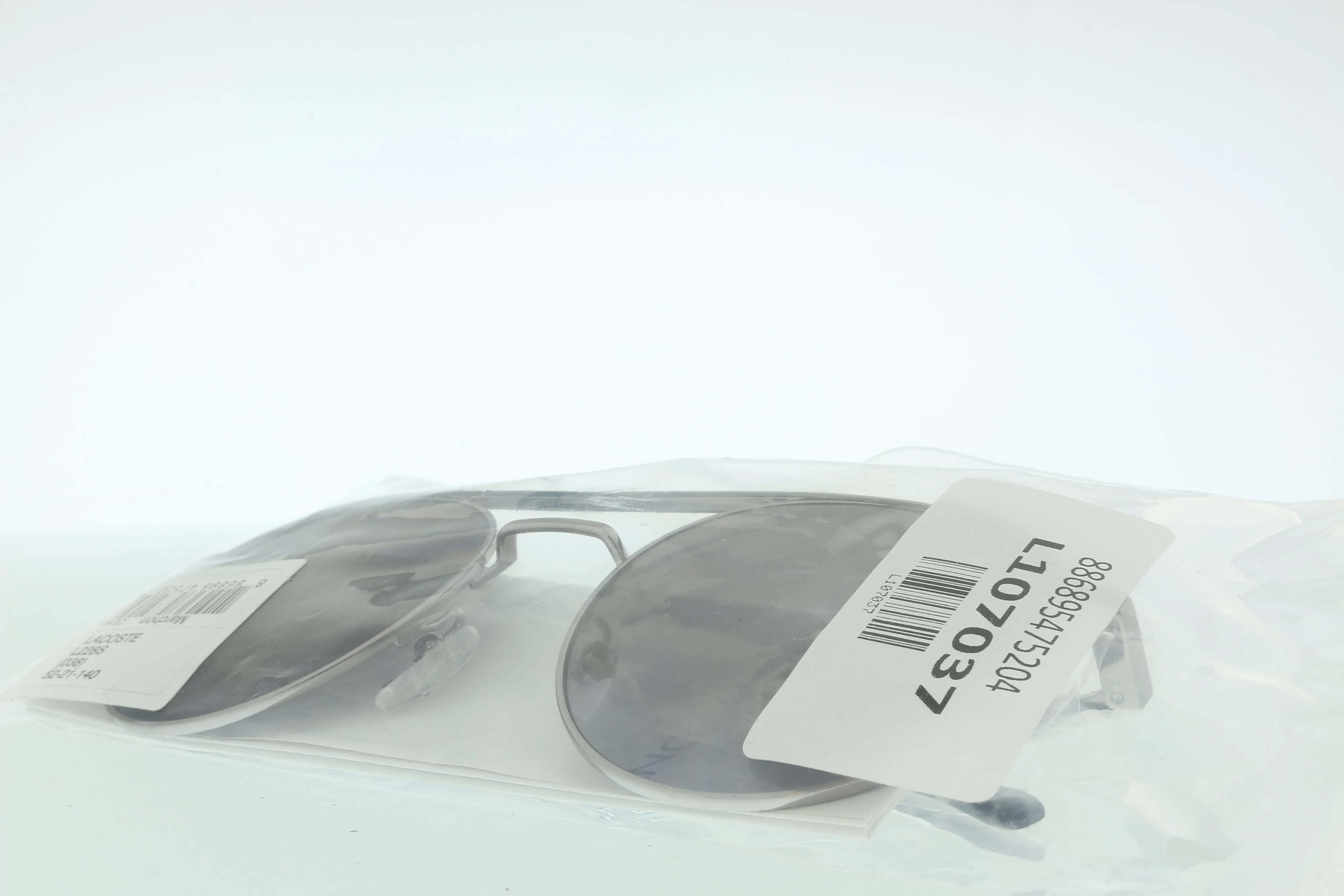 Lacoste L228S 038 Light Grey Oval Sunglasses